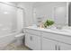The bright bathroom boasts double sinks, white cabinets, and a shower-tub combo at 863 Agostino Dr., Myrtle Beach, SC 29579