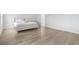 Minimalist bedroom design with plush bedding and hardwood floors at 863 Agostino Dr., Myrtle Beach, SC 29579