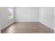 A bright, empty bedroom with hardwood floors and a large window at 863 Agostino Dr., Myrtle Beach, SC 29579