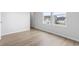 The bright bedroom boasts wood-look flooring and an open doorway to a closet, creating an airy and functional space at 863 Agostino Dr., Myrtle Beach, SC 29579