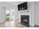Cozy fireplace in the living room with sliding glass doors leading to a pool area at 863 Agostino Dr., Myrtle Beach, SC 29579