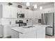 Modern kitchen featuring stainless steel appliances, white cabinetry, and a kitchen island with a sink at 863 Agostino Dr., Myrtle Beach, SC 29579