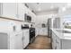 Bright kitchen with stainless steel appliances, white cabinets, and sleek countertops at 863 Agostino Dr., Myrtle Beach, SC 29579