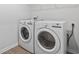 The modern laundry room features a side-by-side washer and dryer for convenient home maintenance at 863 Agostino Dr., Myrtle Beach, SC 29579
