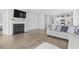 Comfortable living room with hardwood floors, a cozy fireplace, and a view to the kitchen at 863 Agostino Dr., Myrtle Beach, SC 29579