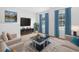 Beautifully staged living room with modern decor, large windows with curtains, and stylish furnishings at 863 Agostino Dr., Myrtle Beach, SC 29579