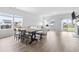 Bright open-plan living and dining area with hardwood floors, natural light, and modern furnishings at 863 Agostino Dr., Myrtle Beach, SC 29579