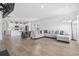 Spacious living area with hardwood flooring, comfortable seating, and an open view to the kitchen at 863 Agostino Dr., Myrtle Beach, SC 29579
