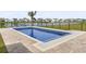 Stunning private pool with a lake view and a palm tree, perfect for relaxing and entertaining at 863 Agostino Dr., Myrtle Beach, SC 29579