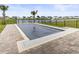 Backyard pool with a safety cover, paver patio, palm trees and a picturesque view of the lake at 863 Agostino Dr., Myrtle Beach, SC 29579