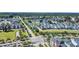 Aerial view of colorful homes, lush landscaping, and a charming street layout at 959 Hendrick Ave. # 0, Myrtle Beach, SC 29577