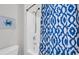 Bright bathroom featuring a tub with a stylish blue and white shower curtain at 959 Hendrick Ave. # 0, Myrtle Beach, SC 29577