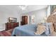 Cozy bedroom with plush blue comforter, wood furniture, and lots of storage at 959 Hendrick Ave. # 0, Myrtle Beach, SC 29577