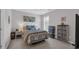 Bedroom with a patterned duvet, neutral carpet, and bedside tables at 959 Hendrick Ave. # 0, Myrtle Beach, SC 29577
