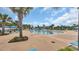 Resort-style pool area with palm trees, lounge chairs, and a beautiful blue sky at 959 Hendrick Ave. # 0, Myrtle Beach, SC 29577