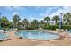 Outdoor pool area with lounge chairs and palm trees, perfect for relaxing at 959 Hendrick Ave. # 0, Myrtle Beach, SC 29577