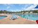 Large outdoor pool with plenty of lounge chairs, umbrellas, and palm trees at 959 Hendrick Ave. # 0, Myrtle Beach, SC 29577