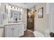 Bathroom with stone tile shower, updated vanity and fixtures, and decor at 9661 Shore Dr. # A1, Myrtle Beach, SC 29572