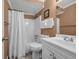 Cozy bathroom with tub and shower combo, white vanity and neutral paint at 9661 Shore Dr. # A1, Myrtle Beach, SC 29572