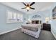 Serene bedroom with a ceiling fan, shuttered window, and neutral decor for relaxation at 9661 Shore Dr. # A1, Myrtle Beach, SC 29572