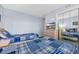Blue toned bedroom with two beds, bureau and mirrored closet at 9661 Shore Dr. # A1, Myrtle Beach, SC 29572