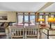 Bright dining area with a large wooden table, seating for eight, and access to a balcony at 9661 Shore Dr. # A1, Myrtle Beach, SC 29572