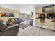 Cozy living area featuring tile floors, comfortable sofas, and an open layout to the dining area at 9661 Shore Dr. # A1, Myrtle Beach, SC 29572