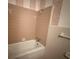 Classic bathroom featuring a bathtub with tile surround and neutral walls at 1002 S Beech Ave., Andrews, SC 29510