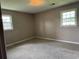 Cozy bedroom with carpet floors, two windows, and neutral wall color at 1002 S Beech Ave., Andrews, SC 29510