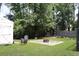 Enjoy this backyard with an outdoor fireplace, seating, and shed for extra storage at 1014 Bay Dr., Surfside Beach, SC 29575
