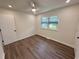 Bright bedroom with new flooring, ceiling fan, modern window shades, and fresh paint at 1014 Bay Dr., Surfside Beach, SC 29575