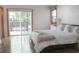 Bright bedroom with access to a deck through glass sliding doors and wood-look flooring at 1014 Bay Dr., Surfside Beach, SC 29575