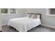 This bedroom offers natural light, a double bed, and warm-colored flooring at 1014 Bay Dr., Surfside Beach, SC 29575