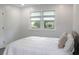 Bright bedroom with fresh paint and two large windows providing ample light at 1014 Bay Dr., Surfside Beach, SC 29575