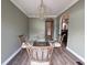 A formal dining room with a chandelier and a glass table and seating for six at 1014 Bay Dr., Surfside Beach, SC 29575
