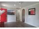 Bright, open-concept living area with modern flooring, fresh paint, and a vibrant red door for a pop of color at 1014 Bay Dr., Surfside Beach, SC 29575