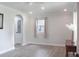Sunlit living room featuring new flooring, recessed lighting, arched entryways, and a view of the pantry at 1014 Bay Dr., Surfside Beach, SC 29575