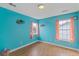 Bedroom features two windows and playful decor, creating a cheerful and inviting atmosphere at 1033 Mccall Loop, Conway, SC 29526
