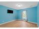 Bright bedroom featuring hardwood floors, a window, and neutral tones for a cozy feel at 1033 Mccall Loop, Conway, SC 29526