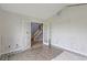 Renovation ready bedroom with fresh paint, light vinyl floors, and glass door at 1033 Mccall Loop, Conway, SC 29526