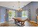 Bright dining room featuring a chandelier and access to the exterior at 1033 Mccall Loop, Conway, SC 29526