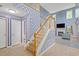 Open foyer featuring wood stairs and tile flooring, leading into a spacious living area at 1033 Mccall Loop, Conway, SC 29526