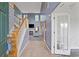 Grand foyer featuring wood staircase, tile floors, and tall ceilings leading into the living room at 1033 Mccall Loop, Conway, SC 29526