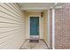 Inviting front door with sidelights, a welcome mat, and a stylish exterior light fixture for added curb appeal at 1033 Mccall Loop, Conway, SC 29526