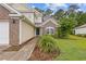 Close-up of the front entrance, featuring a well-lit porch, tidy landscaping, and an inviting front door at 1033 Mccall Loop, Conway, SC 29526