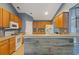 Spacious kitchen with wood cabinets, white appliances and a wood-look countertop island at 1033 Mccall Loop, Conway, SC 29526