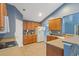 Open kitchen features wood cabinetry, tile floor, plenty of countertop space and staircase view at 1033 Mccall Loop, Conway, SC 29526