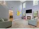 Spacious living room with fireplace, large windows, and tall ceilings at 1033 Mccall Loop, Conway, SC 29526