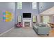 Spacious living room with fireplace, large windows, and tall ceilings at 1033 Mccall Loop, Conway, SC 29526