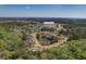 Overhead view of neighborhood near lake with tree coverage around the homes at 104 Clovis Circle, Myrtle Beach, SC 29579